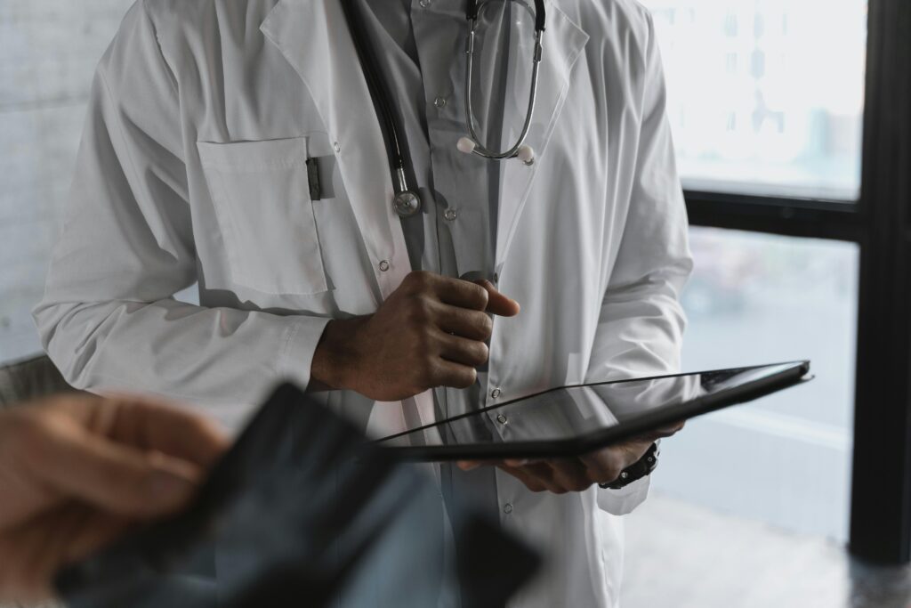 Doctor holding an ipad.